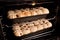 Homemade hot cross buns baking in oven