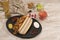 Homemade hot dog with white sausages on tray with various condiments and Canadian flag viewed from above