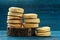 Homemade imperfect cookies in piles on deep blue background