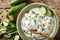 Homemade Indian raita dressing with herbs, spices and cucumber c