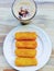 homemade indonesian risoles and cappucino,top view