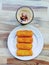 homemade indonesian risoles and cappucino,top view