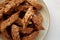 Homemade Italian Cantuccini with Almond and Coffee on a Plate on a gray surface, side view. Crispy Almond and Coffee Cookies