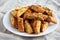 Homemade Italian Cantuccini with Almonds on a White Plate, side view. Crispy Almond Cookies. Close-up