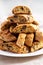 Homemade Italian Cantuccini with Chocolate on a White Plate, low angle view. Crispy Chocolate Cookies. Close-up