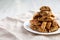 Homemade Italian Cantuccini with Chocolate on a White Plate, low angle view. Crispy Chocolate Cookies. Space for text