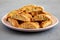 Homemade Italian Cantuccini with Pistachios and Citron on a Plate, side view. Crispy Pistachio and Citron Cookies