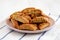 Homemade Italian Cantuccini with Pistachios and Citron on a Plate, side view. Crispy Pistachio and Citron Cookies. Close-up