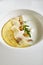Homemade Italian Cream Polenta, Boiled Cornmeal or Porridge with Porcini Mushrooms and Pecorino Cheese Top View