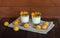 Homemade italian dessert panna cotta with fresh apricots served in small transparent glasses. Selective focus