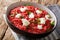 Homemade Italian Orzotto perlotto from barley with beets and goat cheese close-up on a plate. horizontal