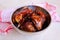 Homemade Kalasan Grilled Chicken Ayam Bakar with red table cloth from Kalasan, Yogyakarta, Indonesia from up above front view