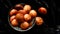 Homemade Kerala snack unniyappam in dark background