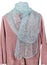 Homemade knitted warm woolen women`s  gray scarf hanging on a pink sweater isolated