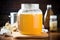 homemade kombucha brewing in a large glass jar