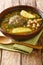 Homemade Kufta bozbash is a traditional Azerbaijani meatball soup and chickpea close-up in a plate. Vertical