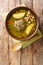Homemade Kufta bozbash is a traditional Azerbaijani meatball soup and chickpea close-up in a plate. Vertical top view