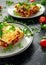 Homemade lasagna with minced beef bolognese and bechamel sauce topped wild arugula, parmesan cheese