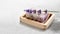 Homemade lavender soap on wooden soap dish on marble table