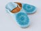 Homemade leather slippers on white background. Pair of blue slipper handmade