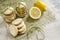 Homemade lemon sugar cookies tied up with rope on linen tablecloth