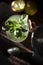 Homemade lemonade with fresh mint leaves at sunset. Moody photography of drink.