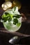 Homemade lemonade with fresh mint leaves at sunset. Moody photography of drink.