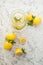 Homemade lemonade on a light background concept. Lemons, glasses, mint, jug and copy space. Summer refreshing drink lemonade