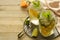 Homemade lemonade with lime, mint in a mason jar on a wooden rustic table. Summer drinks. Copy space