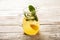 Homemade lemonade in a transparent jug close-up. Lemon, mint and ice lemonade freshness in summer