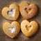 Homemade linzer cookies, sugar powder, neutral background, tasty heart shapes bisquits close-up