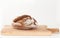 Homemade loaf of bread on wooden board on light background