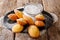 Homemade Madeleine cookies with sugar powder close-up. horizontal