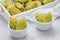 Homemade matcha green tea madeleines on the table and in wooden tray