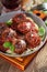 Homemade meatball with Italian pasta in frying pan on rustic wo