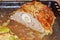 Homemade meatloaf with eggs in Savoy cabbage leaves. last half, on baking sheet, in its own juice. on cut half of a whole egg,