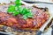 Homemade meatloaf with ketchup and parsley