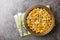 Homemade Mexican Street Corn Esquites with Lime and Chili close-up on the plate. Horizontal top view