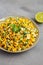 Homemade Mexican Street Corn Esquites on a Plate on a gray surface, side view