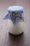 Homemade milk yogurt in glass pot on wooden table