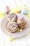 Homemade modern cruffin Easter cake, yeast bun sprinkled powdered sugar. Copy space. White background. Easter concept