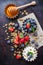 Homemade muesli granola and yogurt with berries on rusty table