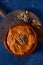 Homemade muhammara in a brown earthenware bowl