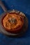 Homemade muhammara in a brown earthenware bowl