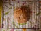 Homemade multi grain sourdough bread left to cool on the cooling rack on the kitchen table