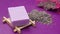 Homemade natural soap bar and lavender flower on purple background