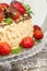 Homemade nutty cake with strawberries. Macro, vertical