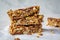 Homemade oat bars with berries and nuts light background. Energy Protein Healthy Bars.