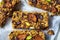 Homemade oat bars with berries and nuts light background top view. Energy Protein Healthy Bars.