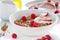 Homemade oat meal granola or muesli with fresh summer fruits â€“ raspberry and strawberry with yogurt